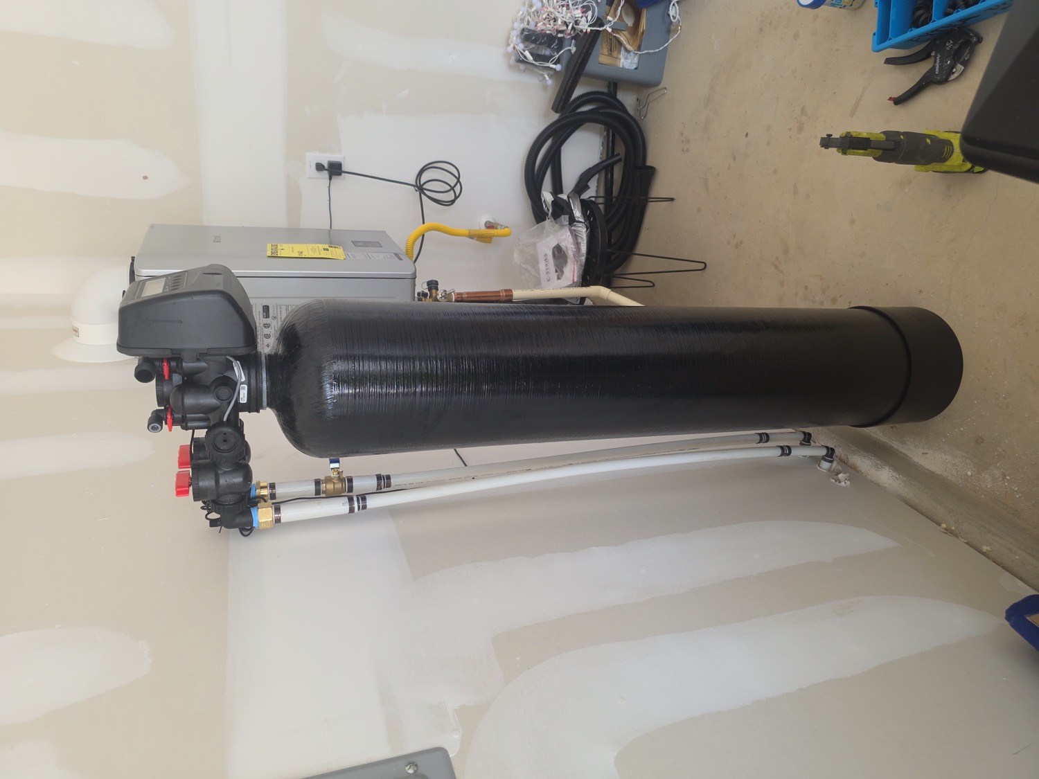 Whole-home water softener and tankless system installed by Homestead Water Co in a San Antonio garage